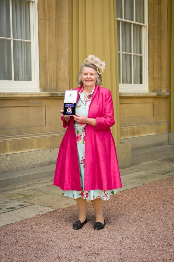 palace outfit pink silk coat MBE outfit